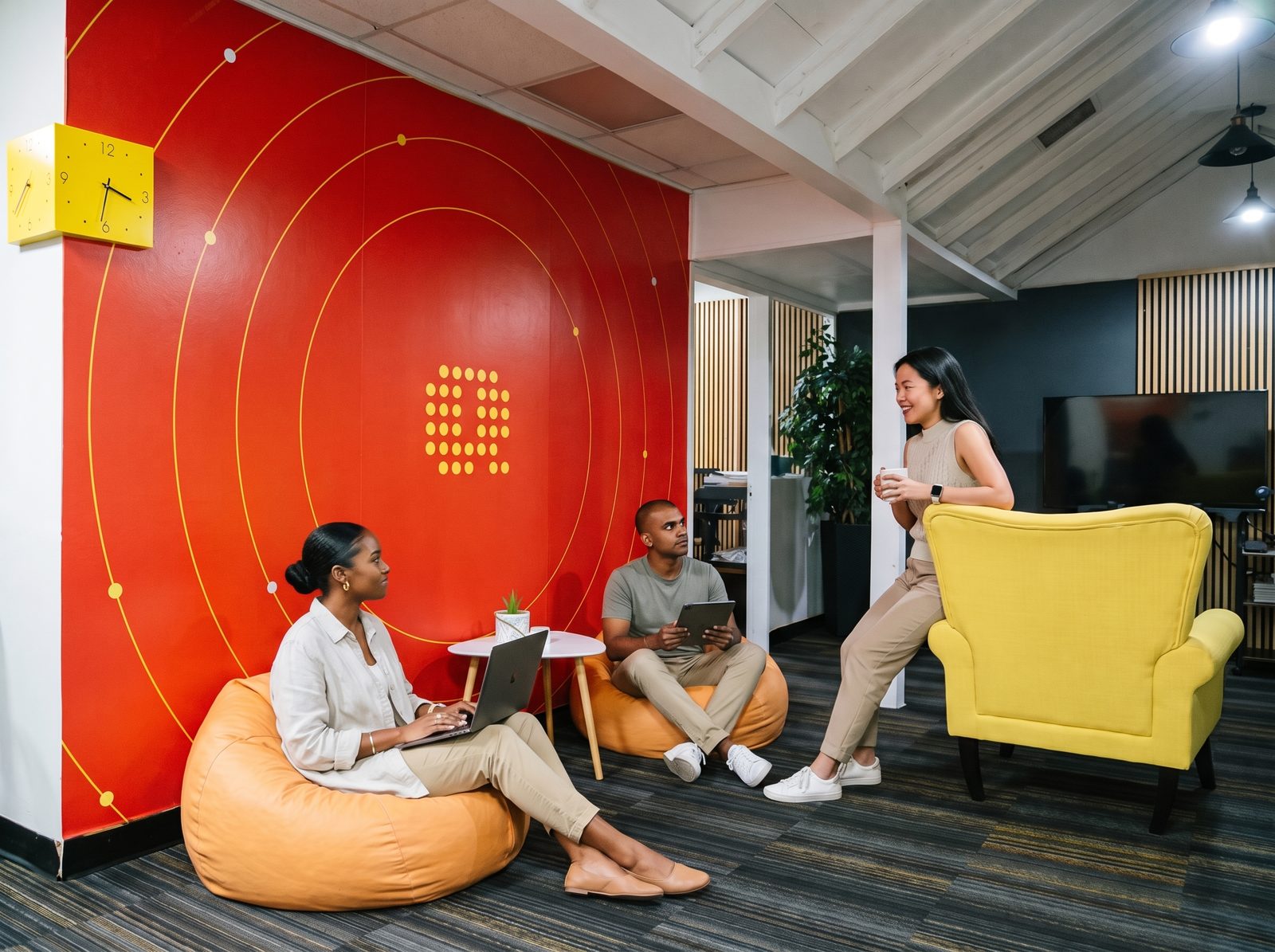 Quoviz team in a strategy discussion in front of the Quoviz wall in our Port of Spain office