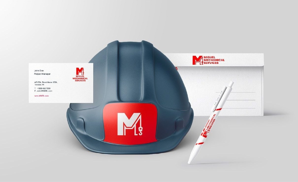Presentation mockup of the logo on a hard hat, business card, envelope and pen