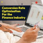 Black woman holding credit card making a purchase online.