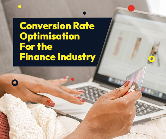 Black woman holding credit card making a purchase online.